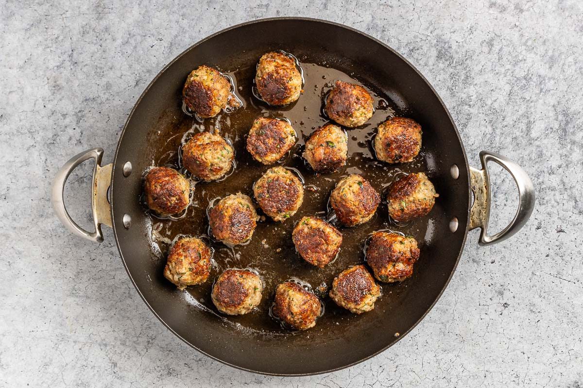 Taste of Home Ricotta Meatballs photo of browning the meatballs.