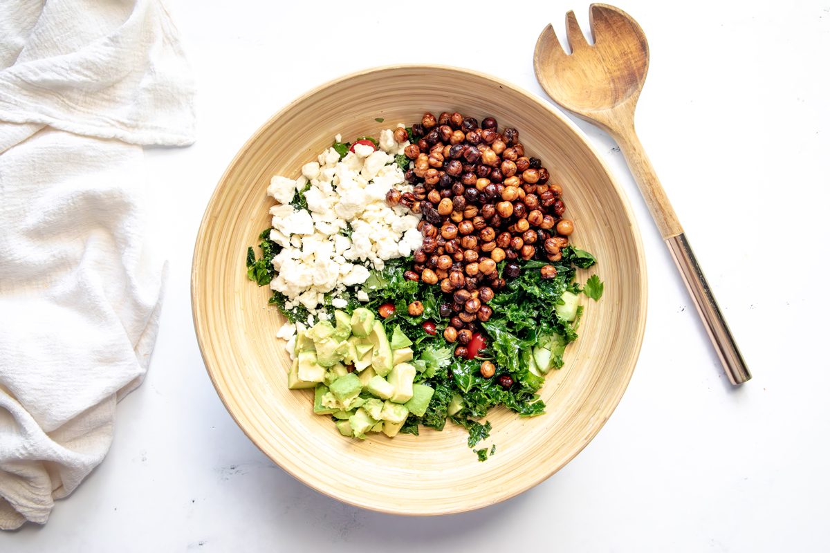 Overhead shot for Taste of Home Roasted Chickpea Salad with all ingredients in a large salad bowl.