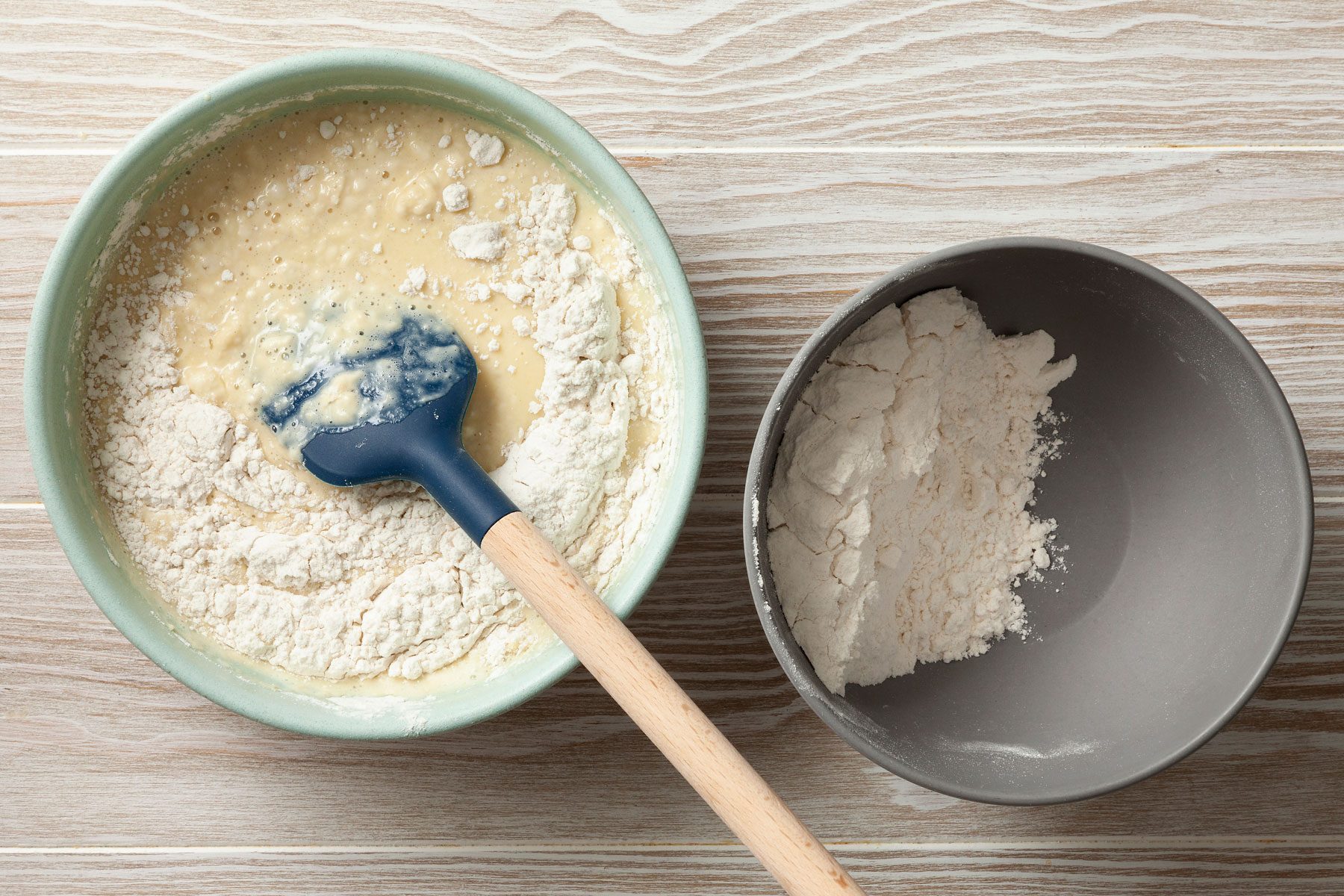 Eggs, milk, sugar and vanilla extract mixture added to the flour and salt mixture.