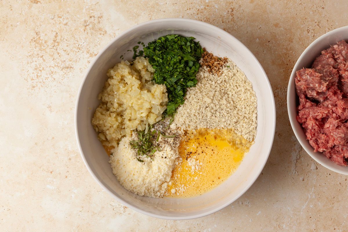 Step 2 of Taste of Home Slow-Cooked Italian Meatballs is to combine the remaining meatball ingredients