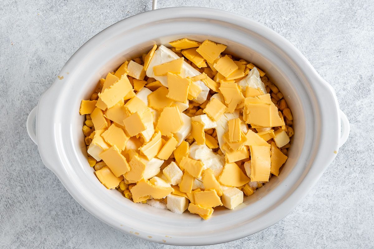 Taste of Home Slow Cooker Cheesy Corn photo of the ingredients in a slow cooker.
