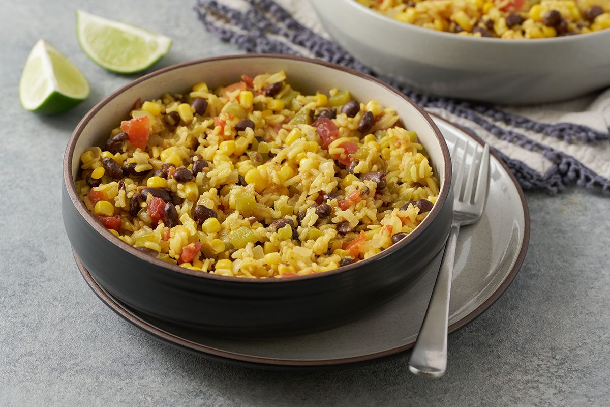 Close-up horizontal shot of the Taste of Home Southwest Rice, highlighting the texture of the fluffy rice, beans, and vegetables mixed together.