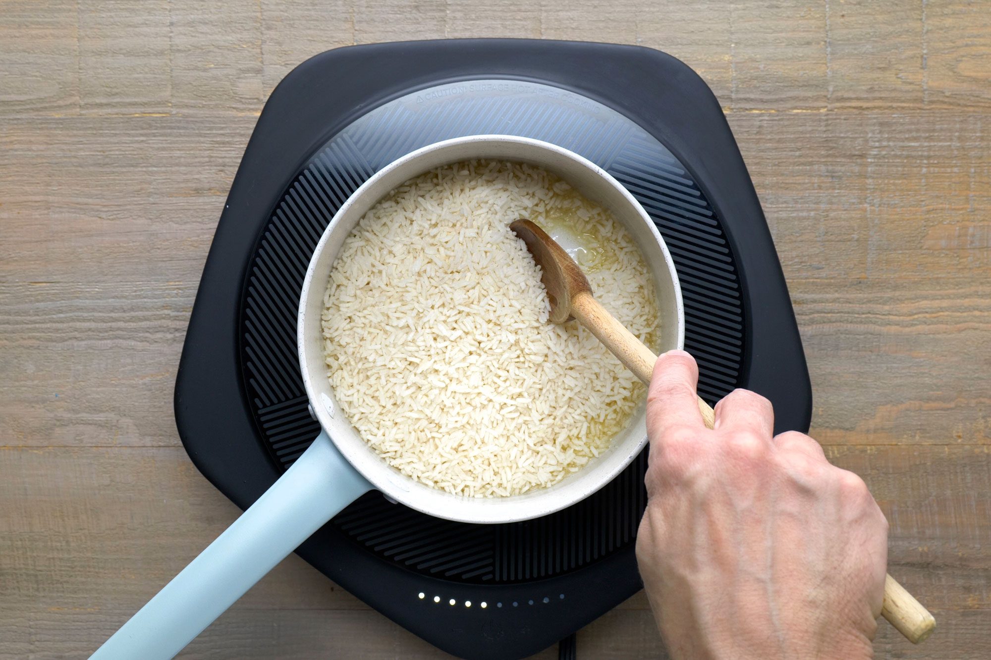 The rice is coated in a thin layer of oil or butter