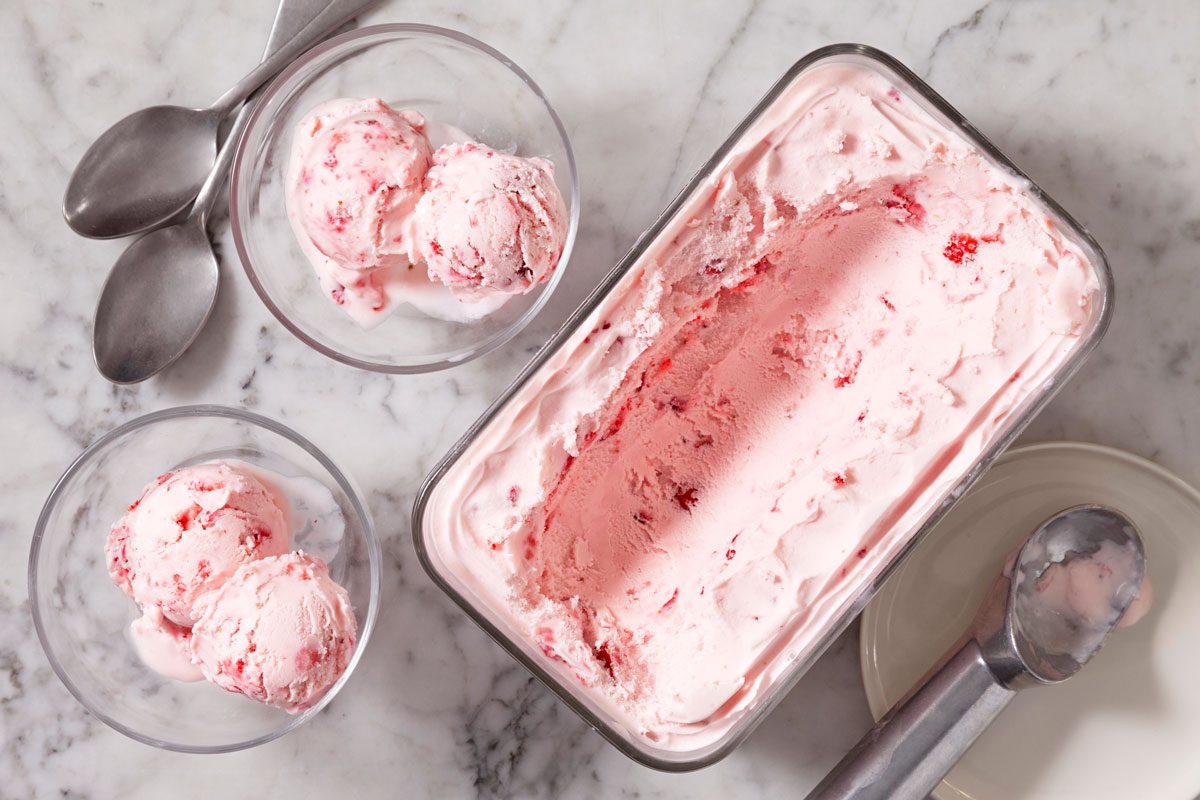 Overhead Shot Of Strawberry Ice Cream scooped into two bowls