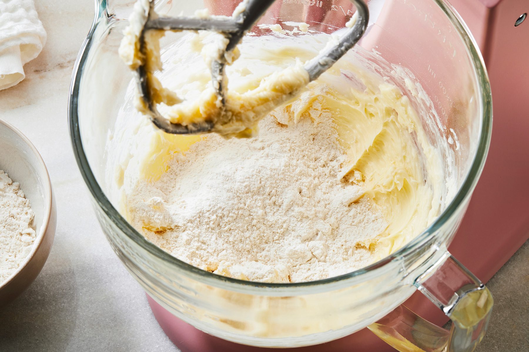 3/4th shot of Gradually adding flour mixture to butter mixture beating on low speed until incorporated;