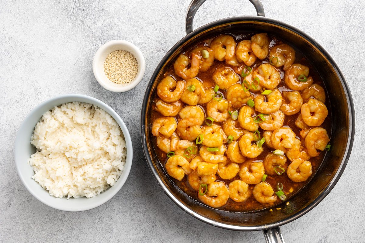 finishing the recipe with green onions.