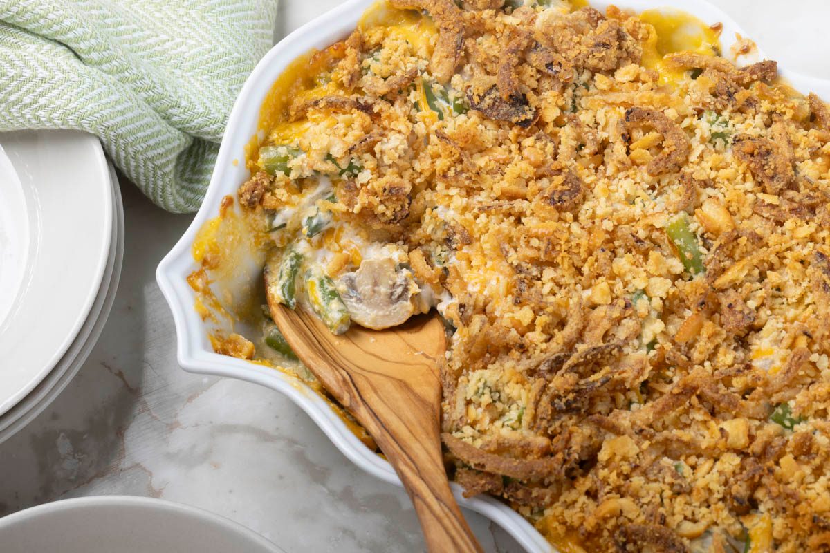 Vegan Green Bean Casserole with wooden spoon