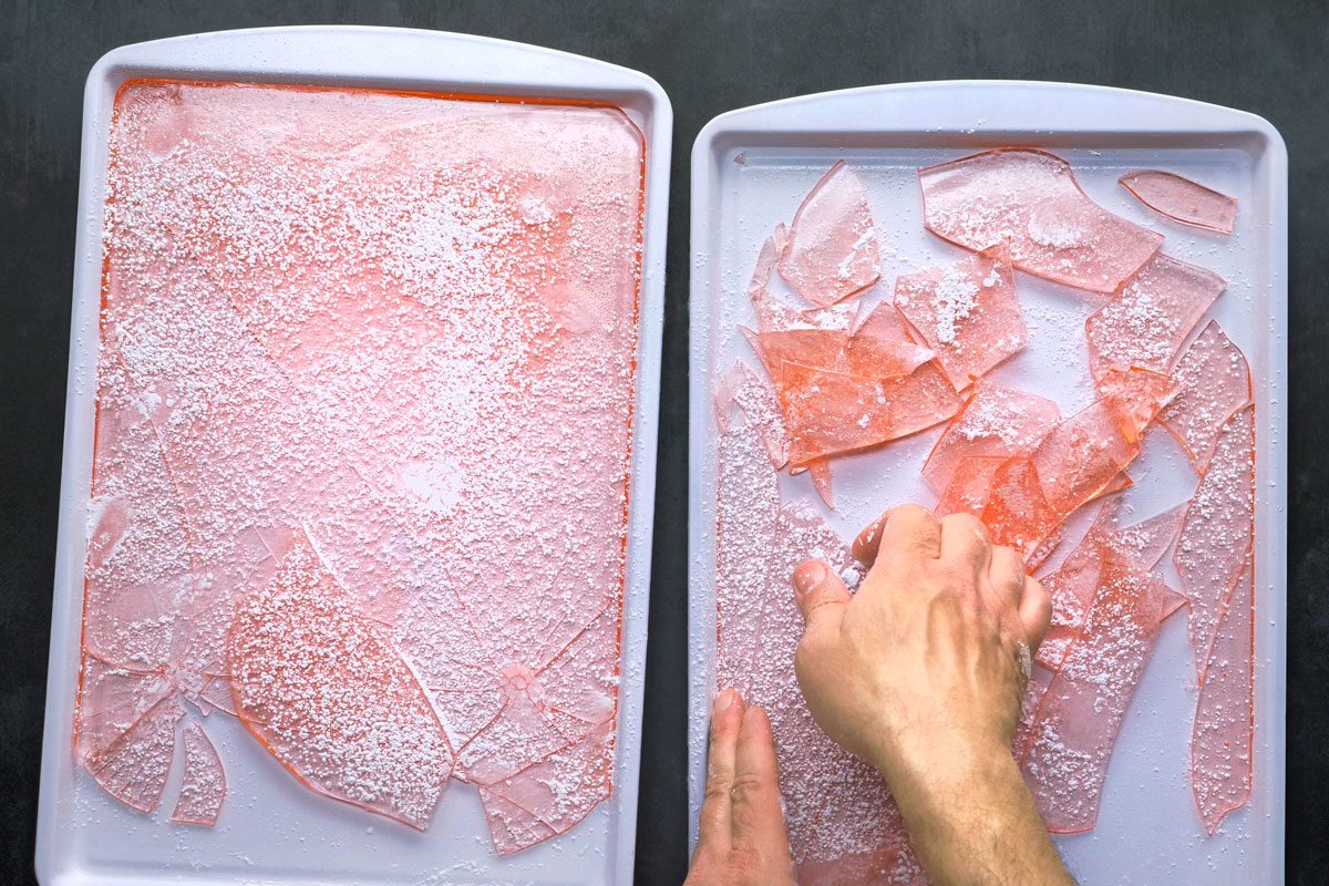 breaking cooled candy into pieces