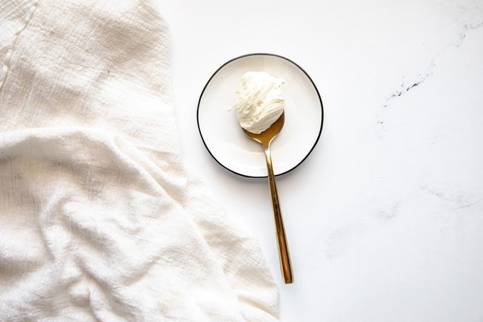 Beauty shot for Taste of Home White Chocolate Ganache, ganache on a golden spoon on a plate.