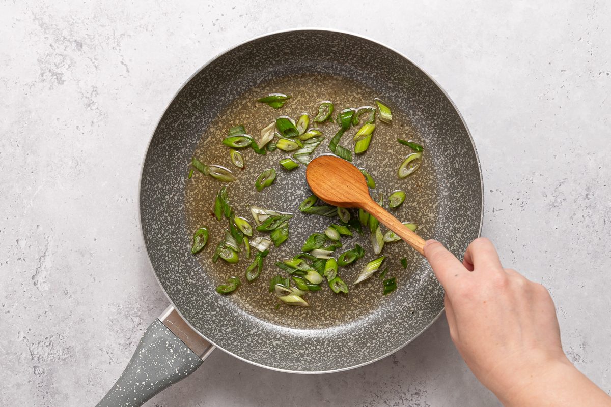 Sliced Green Onion Cooking In Pan