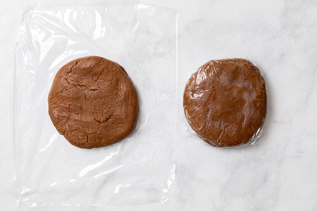 Divided gingerbread cookie dough wrapped in plastic wrap for step three of Wookie Cookie recipe for Taste of Home