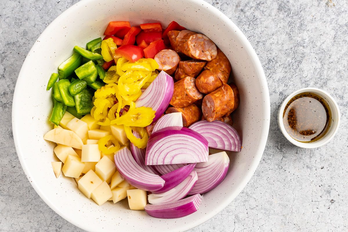 Taste of Home Andouille Sausage and Peppers photo of the ingredients in a large mixing bowl.