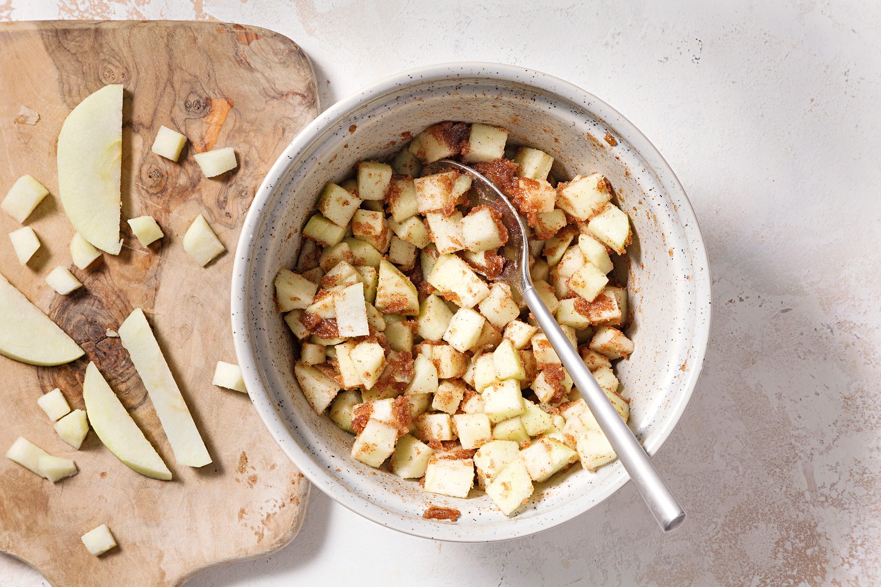 In a small bowl, combine melted butter, brown sugar and cinnamon. Fold in chopped apples