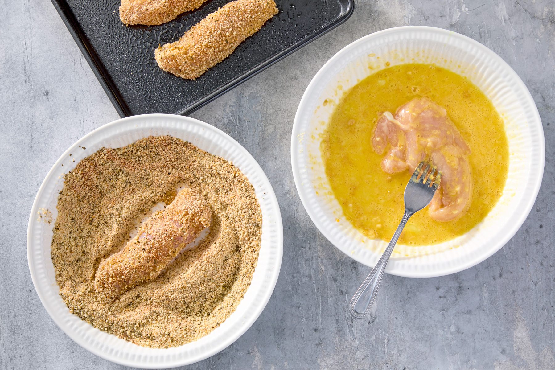 Dip chicken in egg mixture, then coat with crumb mixture.