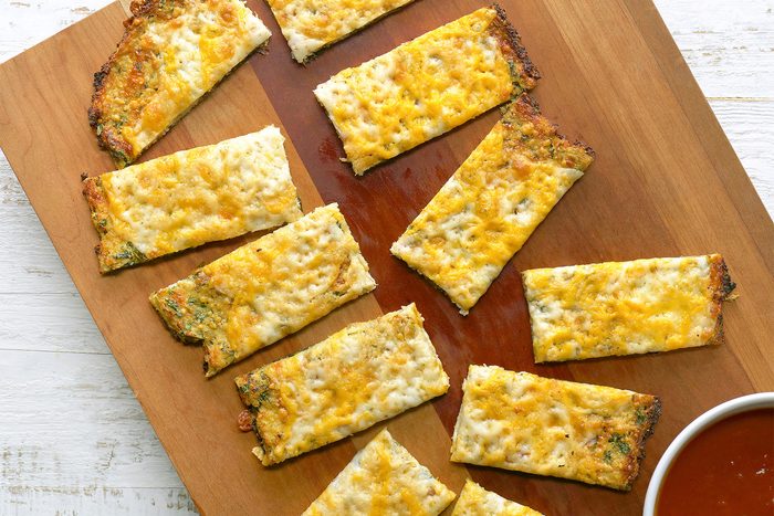 overhead shot of cheesy cauliflower breadsticks