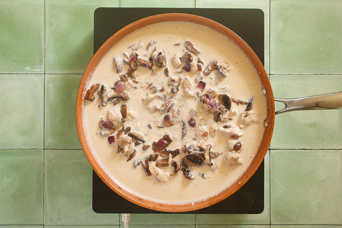 Creamy sauce and chicken in skillet