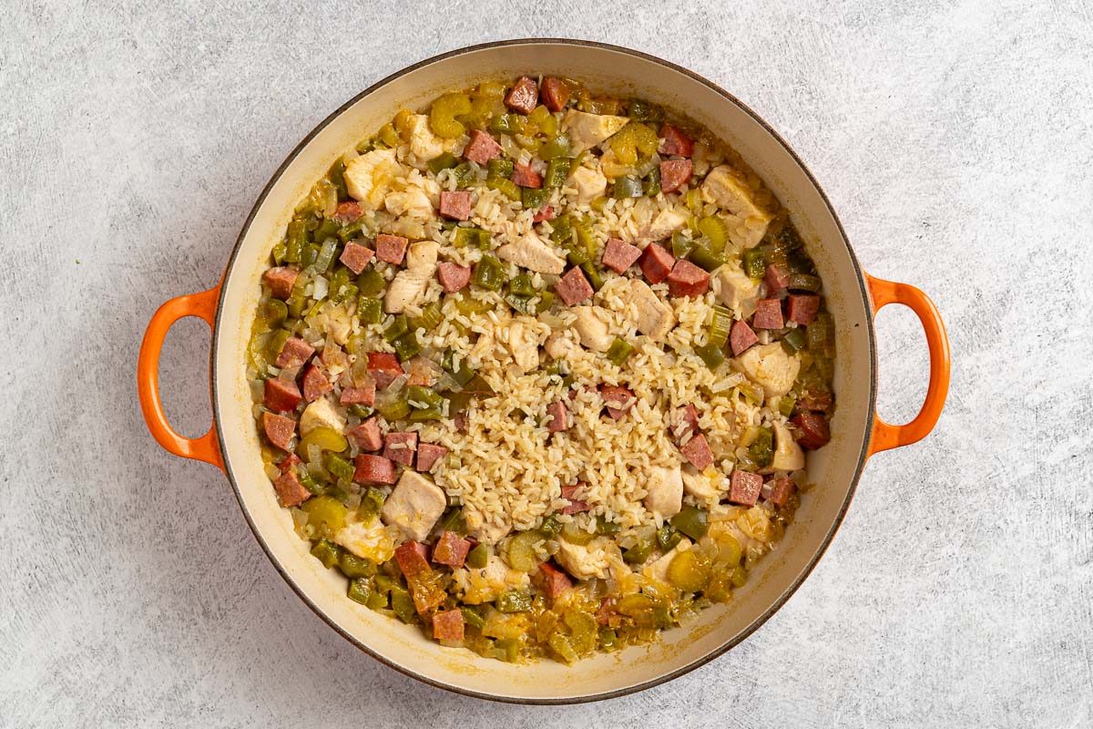 Taste of Home Chicken Jambalaya photo of cooking the chicken and most of the jambalaya ingredients in a skillet.