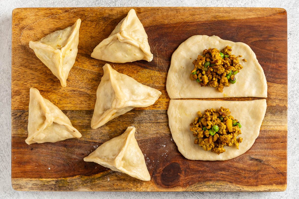 Taste of Home Chicken Samosa photo of shaping the samosas.