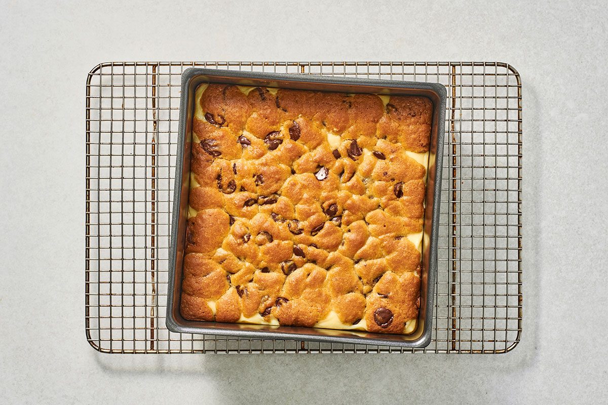 Baked chocolate chip chees bars on a cooling rack
