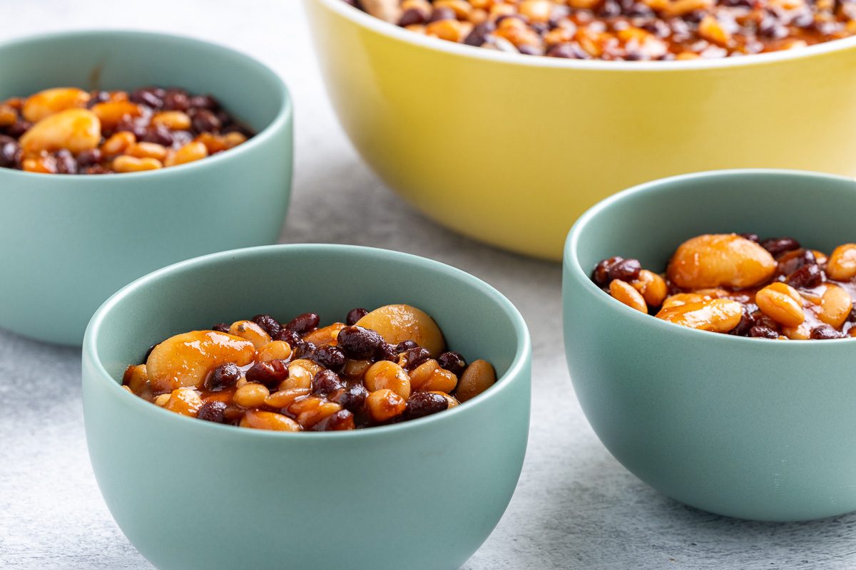 Taste of Home Crockpot Baked Beans recipe photo of the finished recipe portioned into bowls.