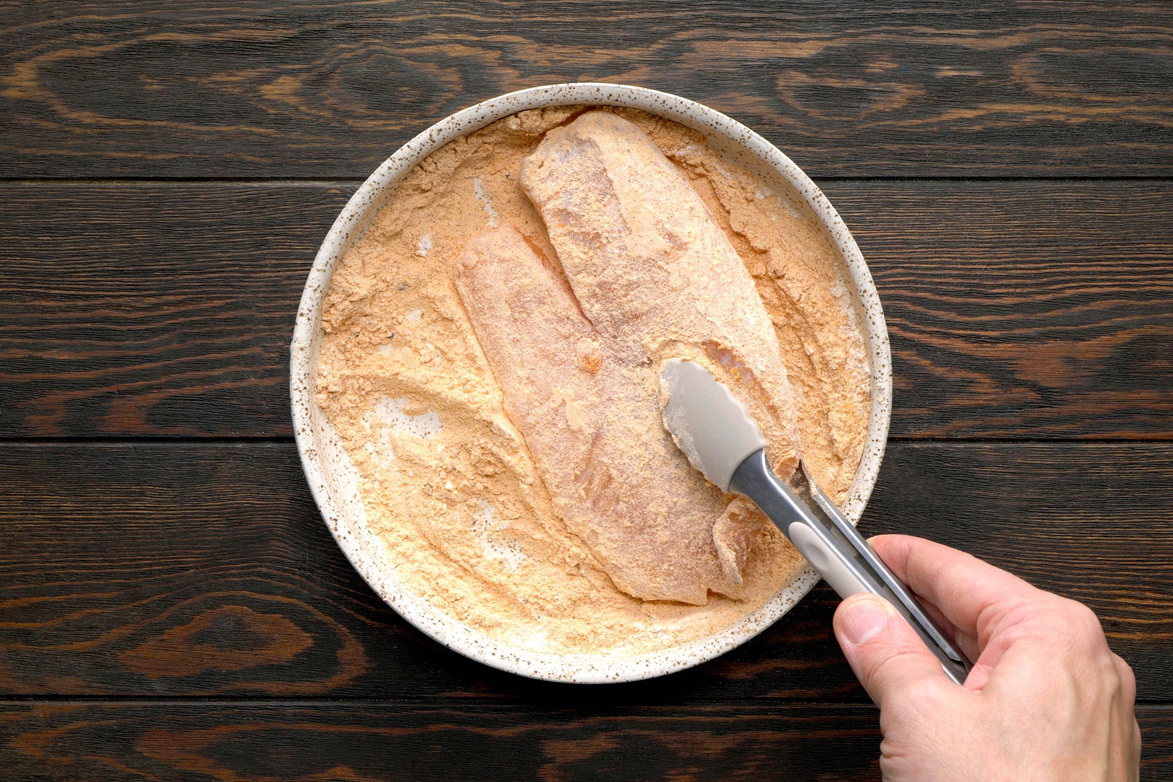 Flour and seasonings coating on raw fish