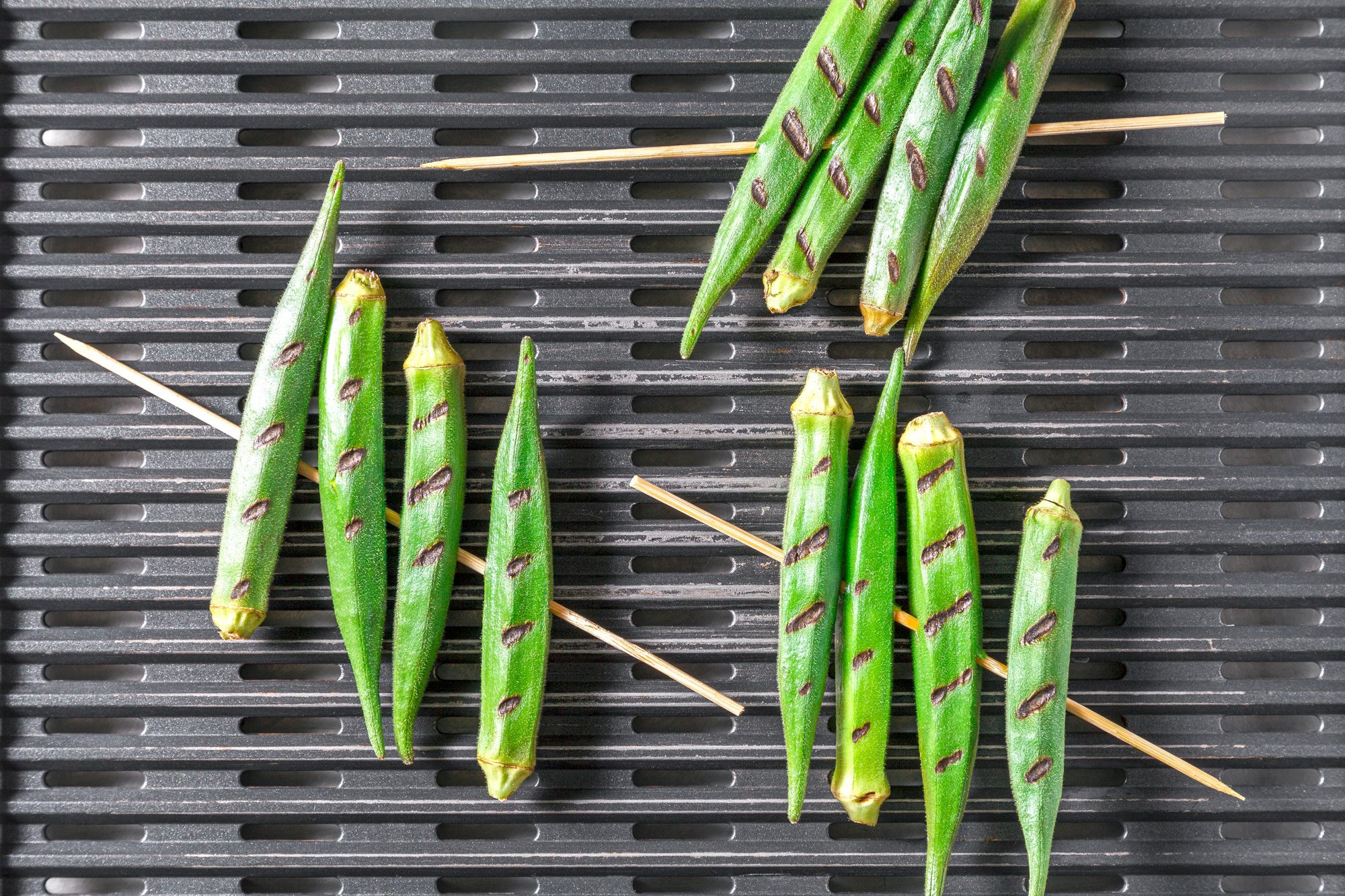Overhead shot of place skewers on the grill and cook until lightly charred; about 3 minutes per side;