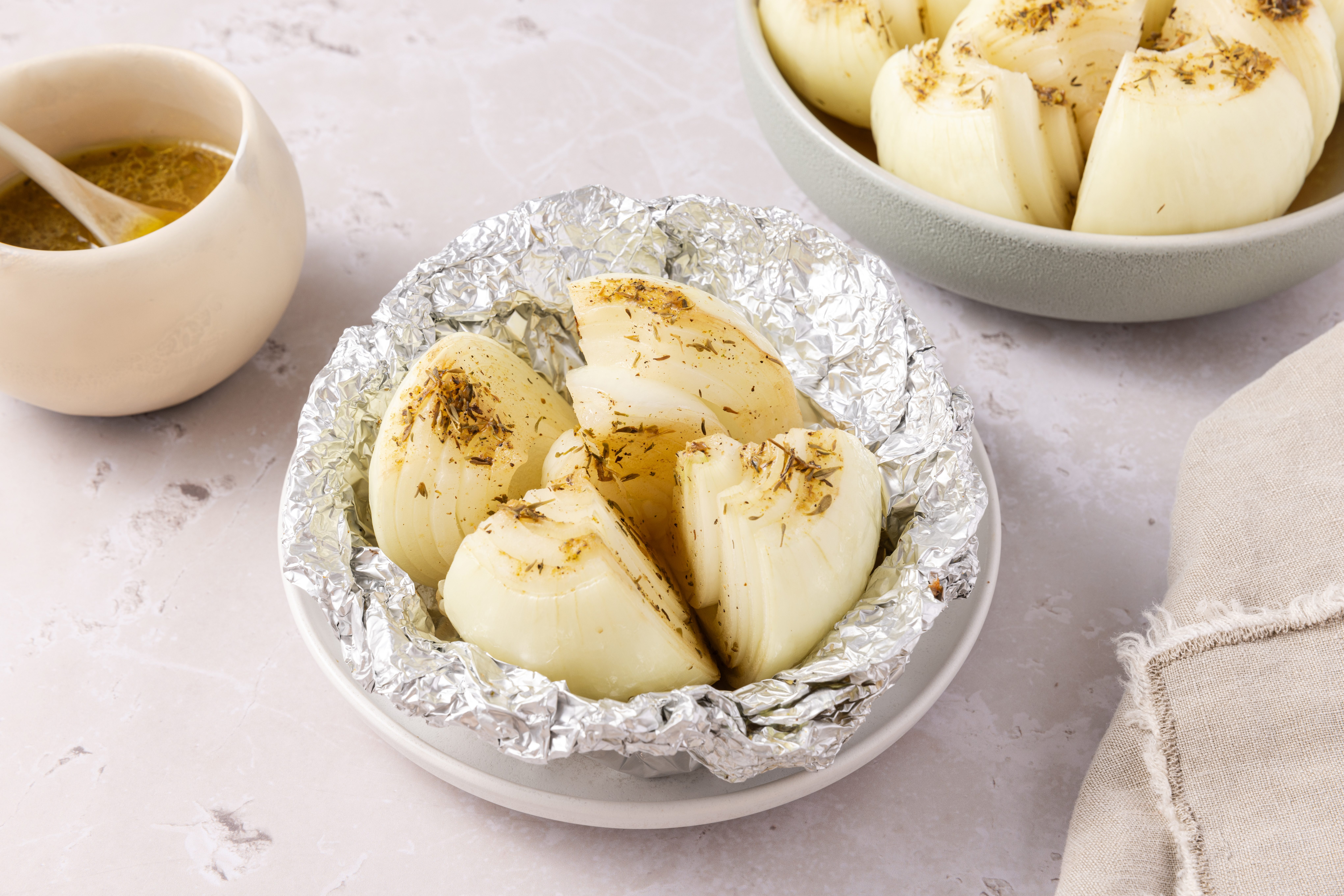 Grilled onions served in small plate and serving dish.