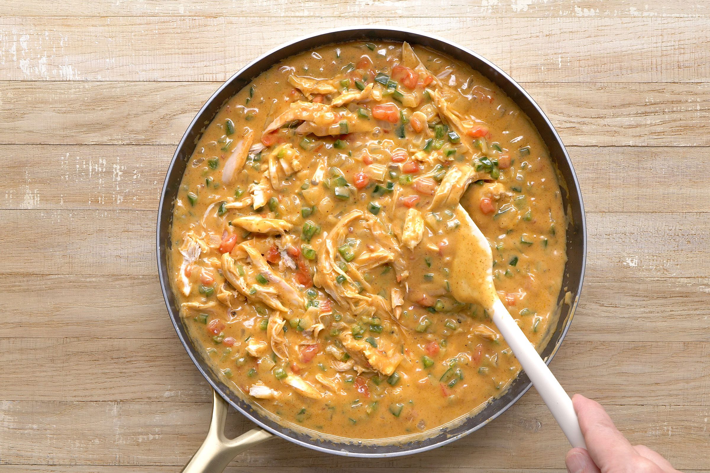 Chicken stirred in chicken broth and vegetables