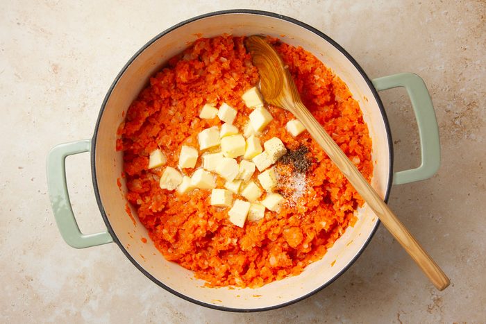Step 2 of Taste of Home Mashed Carrots and Turnips is to mash the vegetables and add the butter and salt and pepper
