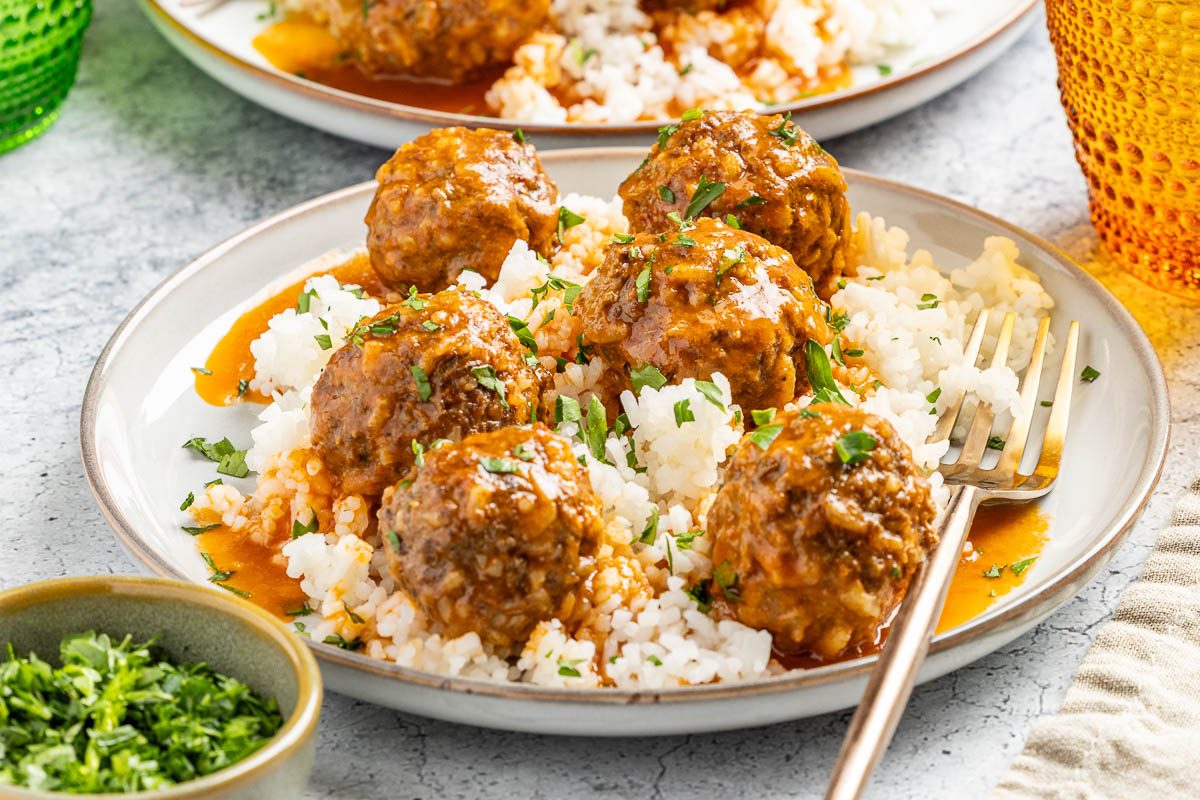 Taste of Home Meatballs and Rice photo of the finished recipe served on plates.