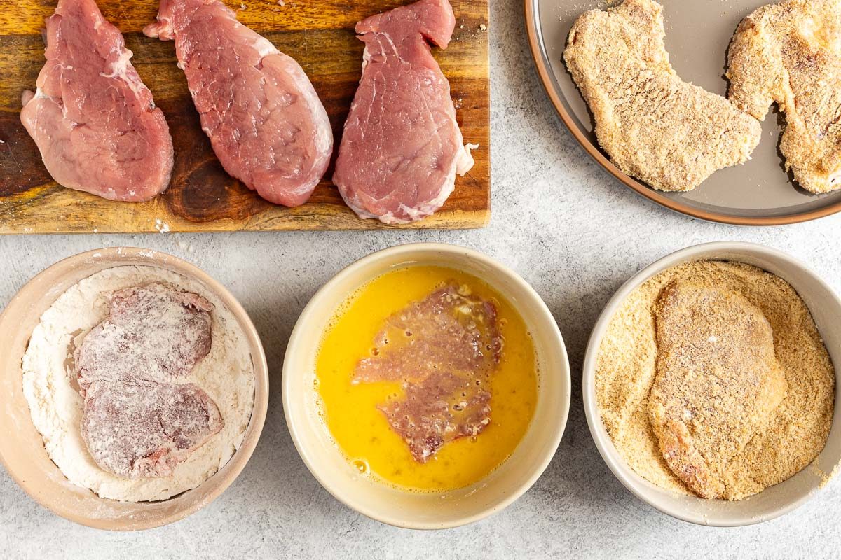 Taste of Home Parmesan Crusted Pork Chops recipe photo of breading the pork.