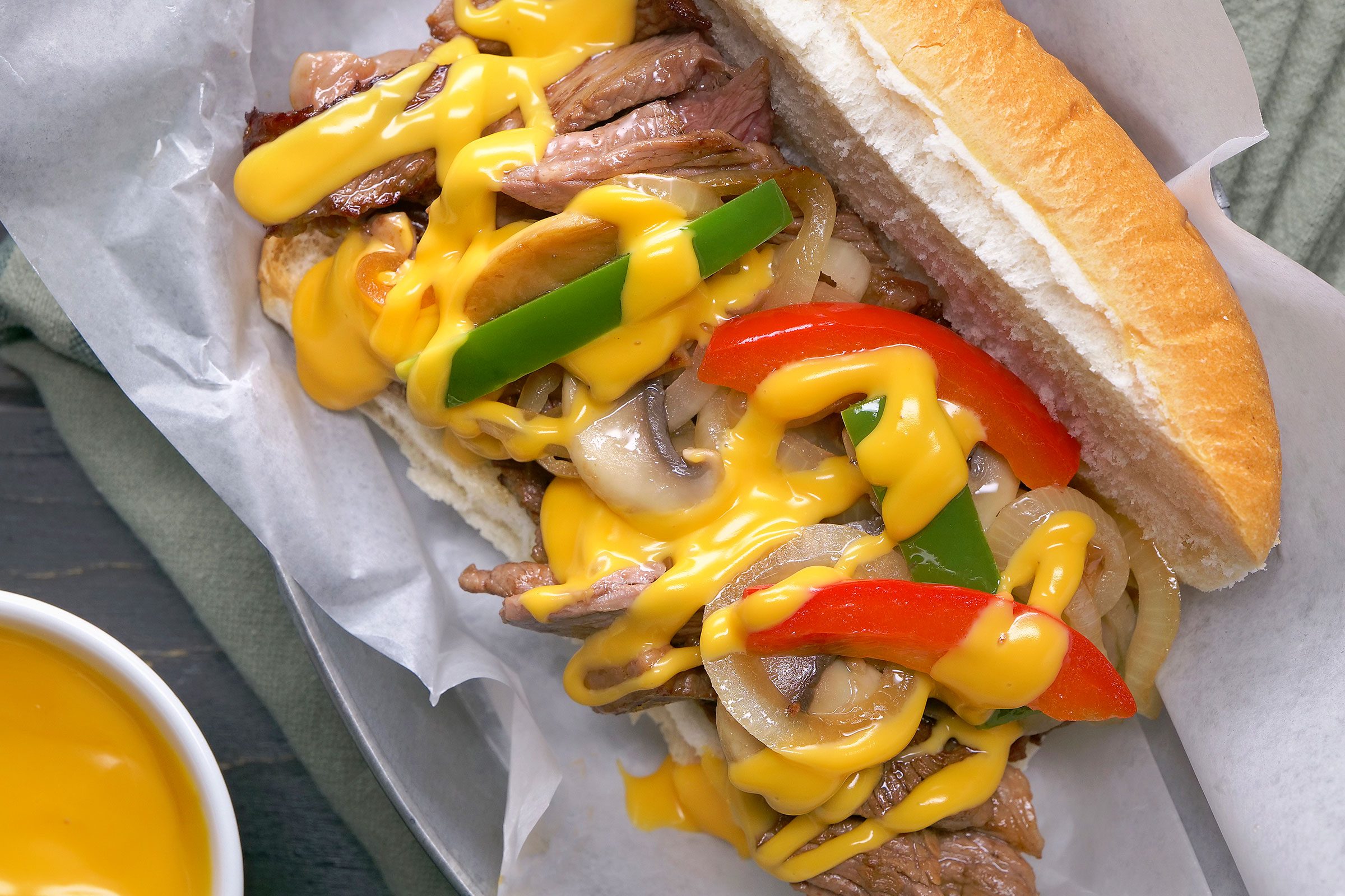 Philly Cheesesteak with a cheese sauce dip on side
