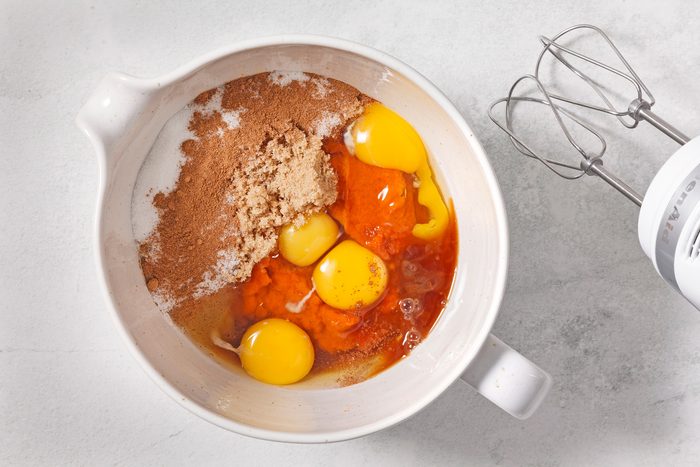In a large bowl, beat canned pumpkin, brown sugar, sugar, eggs, pumpkin pie spice.