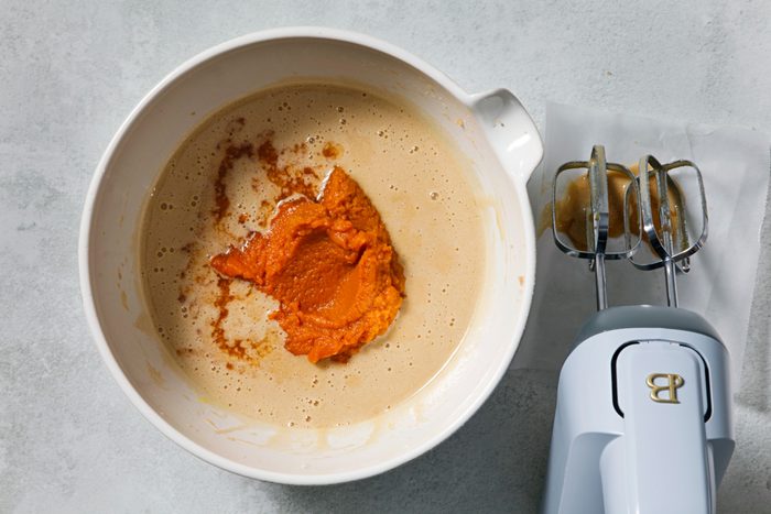 Beat in pumpkin and vanilla extract.