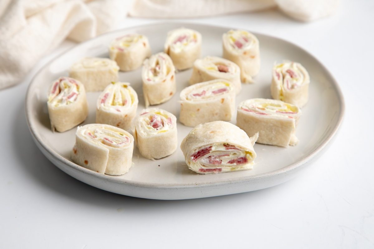 Beauty shot for Taste of Home Salami Roll Ups being served on a large plate.