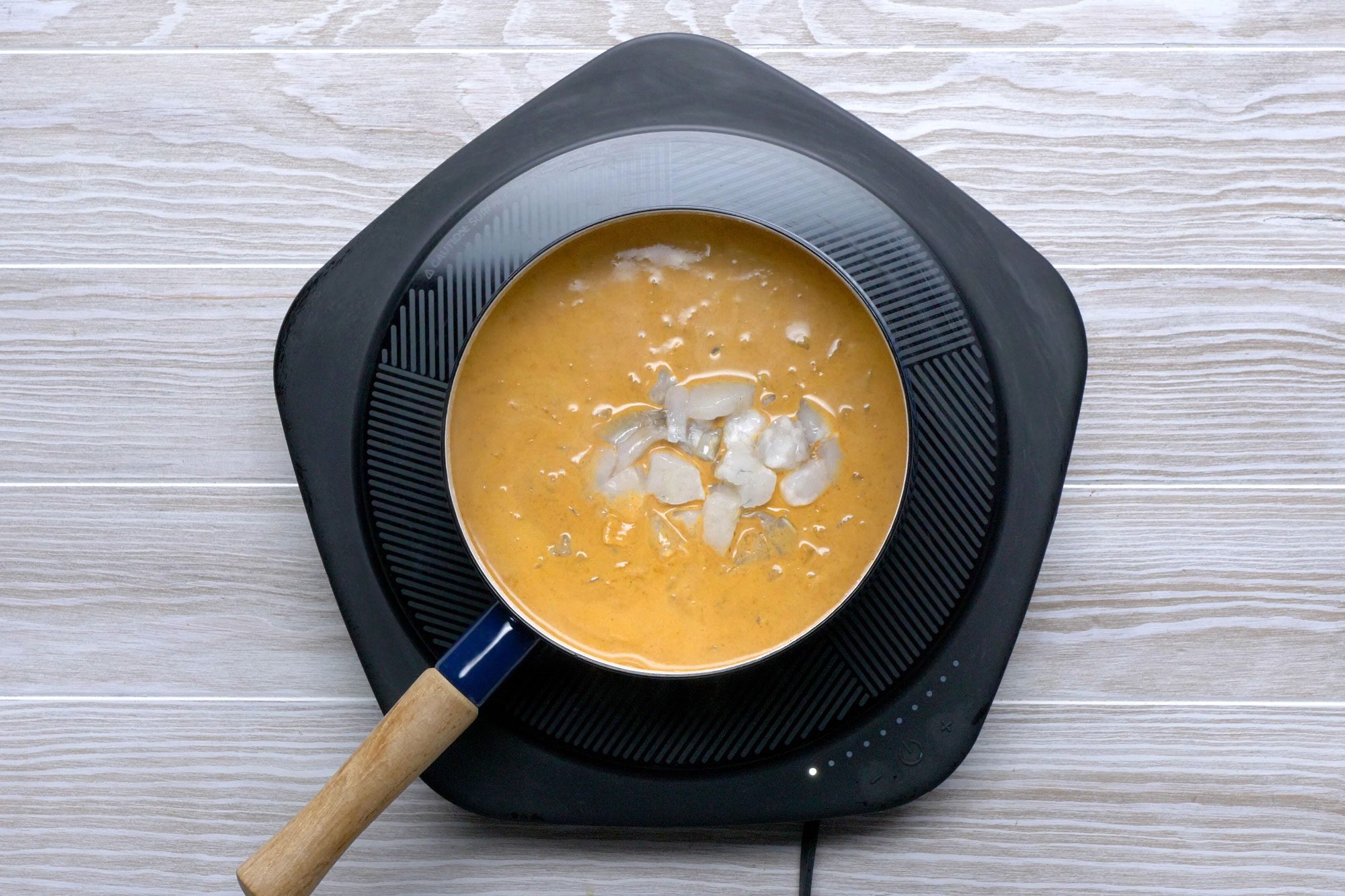 Cut shrimp into bite-size pieces and add to soup