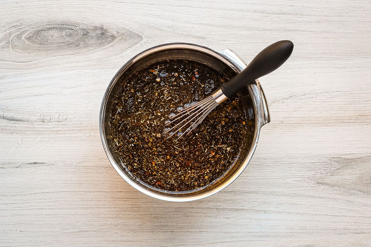A beef and red wine broth mixture with thyme, basil and a touch of crushed red chili flakes.