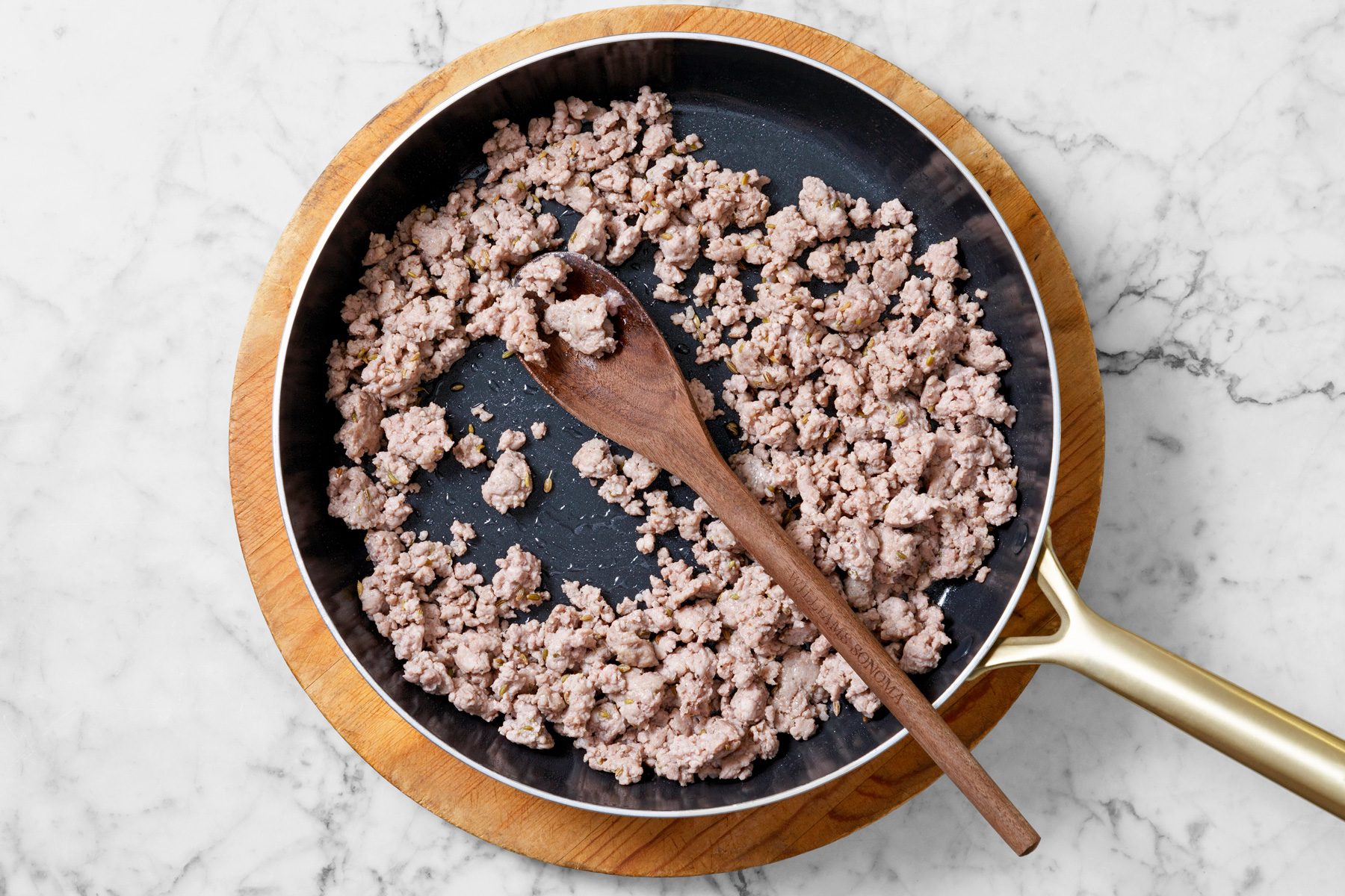 Overhead shot; Meanwhile for stuffing in a large skillet; cook and crumble sausage over medium heat until no longer pink; drain and set aside; spoon; marble surface.