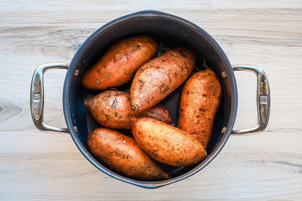 Sweet potatoes in the pan, ready to boil for a sweet potato and pineapple casserole.