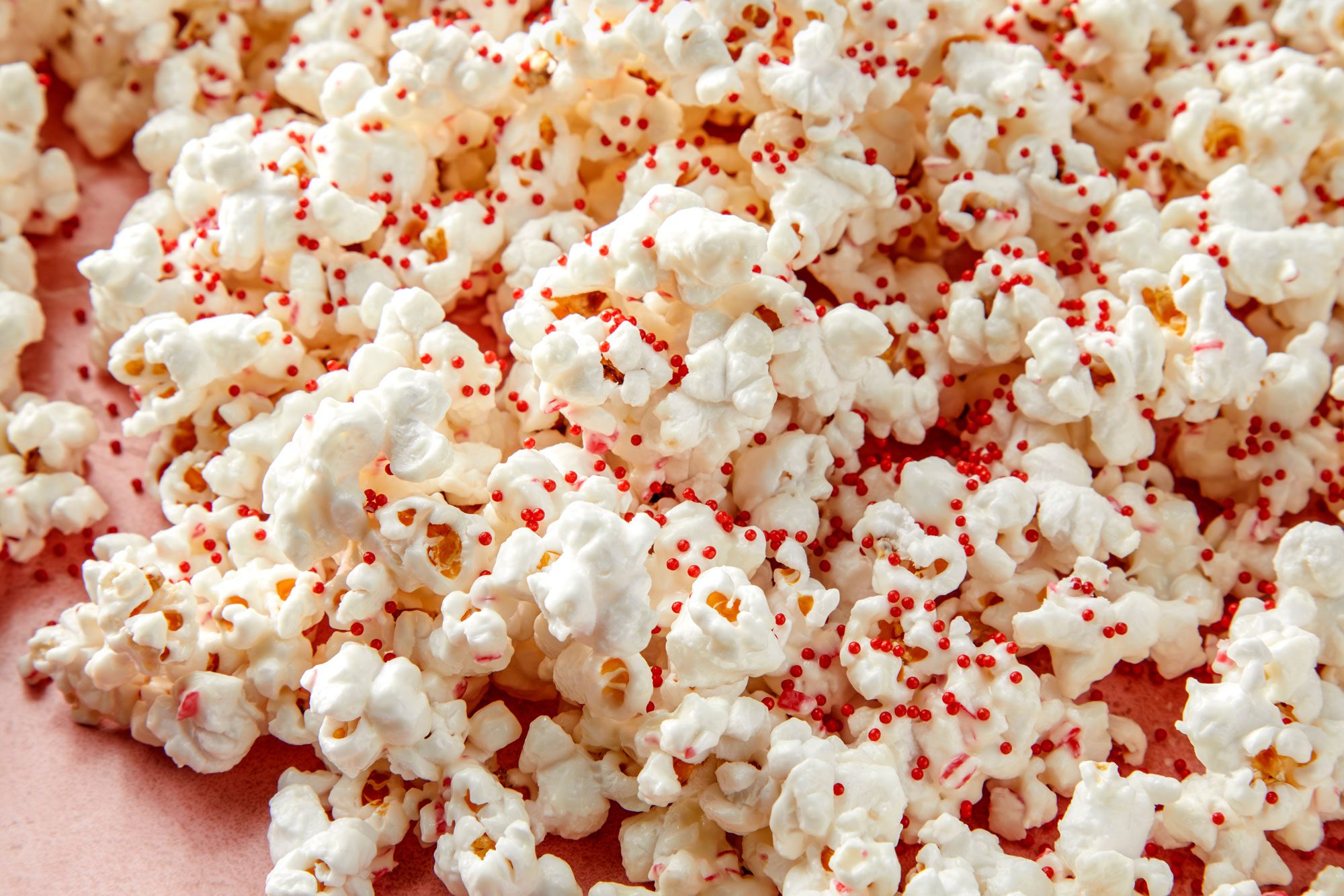 close up shot of popcorns sprinkled with nonpareils