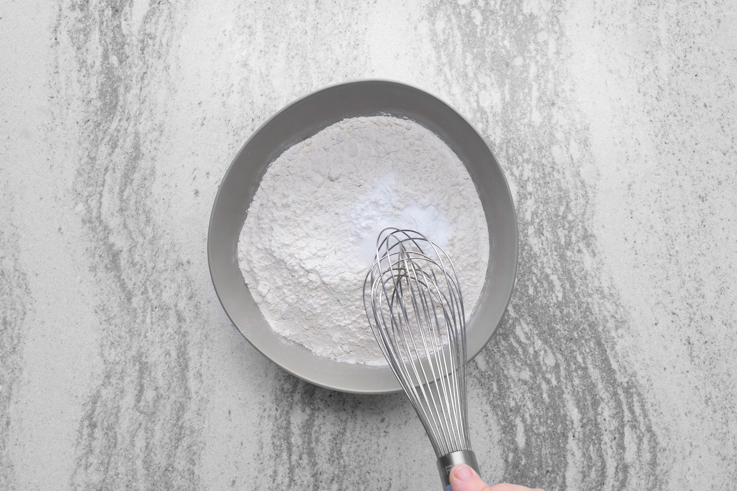 Dry ingredients for lofthouse cookies whisked together in a large bowl
