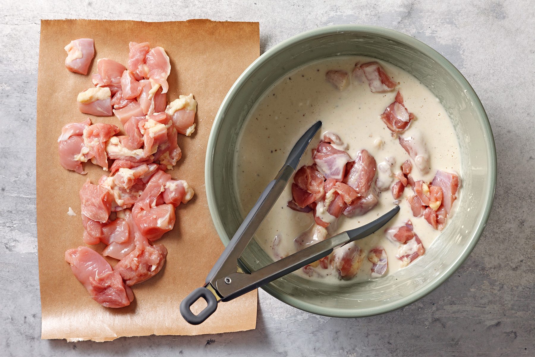 In a large bowl, combine flour, cornstarch, salt and pepper. Whisk in egg, sparkling water and sesame oil until smooth. Add chicken pieces;