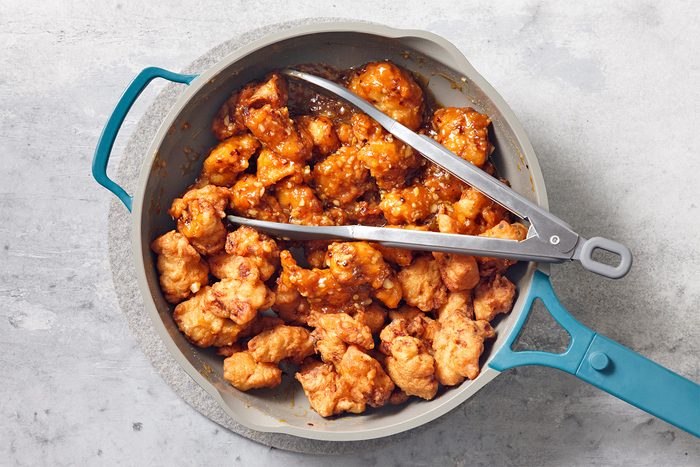 Add fried chicken pieces to sauce; toss gently to coat