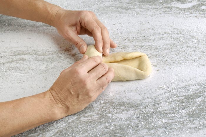 Fold the long edges into the middle, making long even lines on both sides