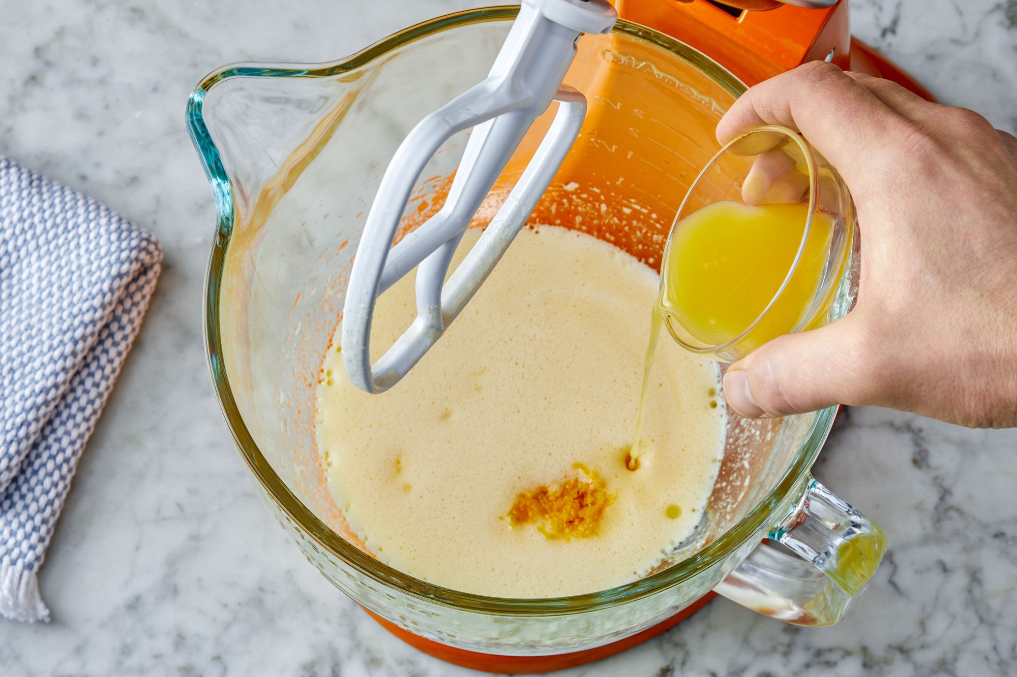Beat in milk, orange zest and orange juice