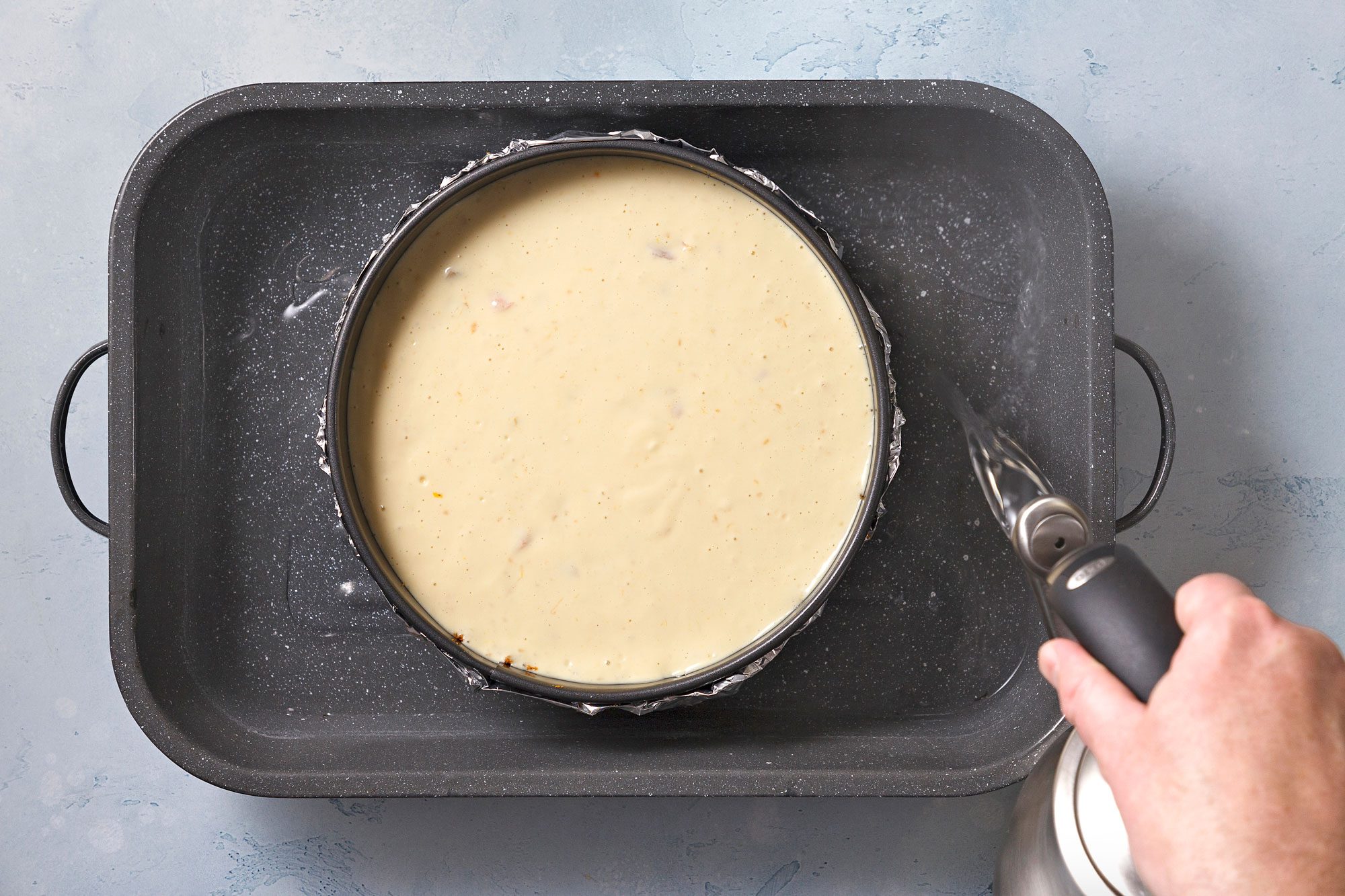 Place springform pan in a larger baking pan; add 1 in. of hot water to larger pan. Bake