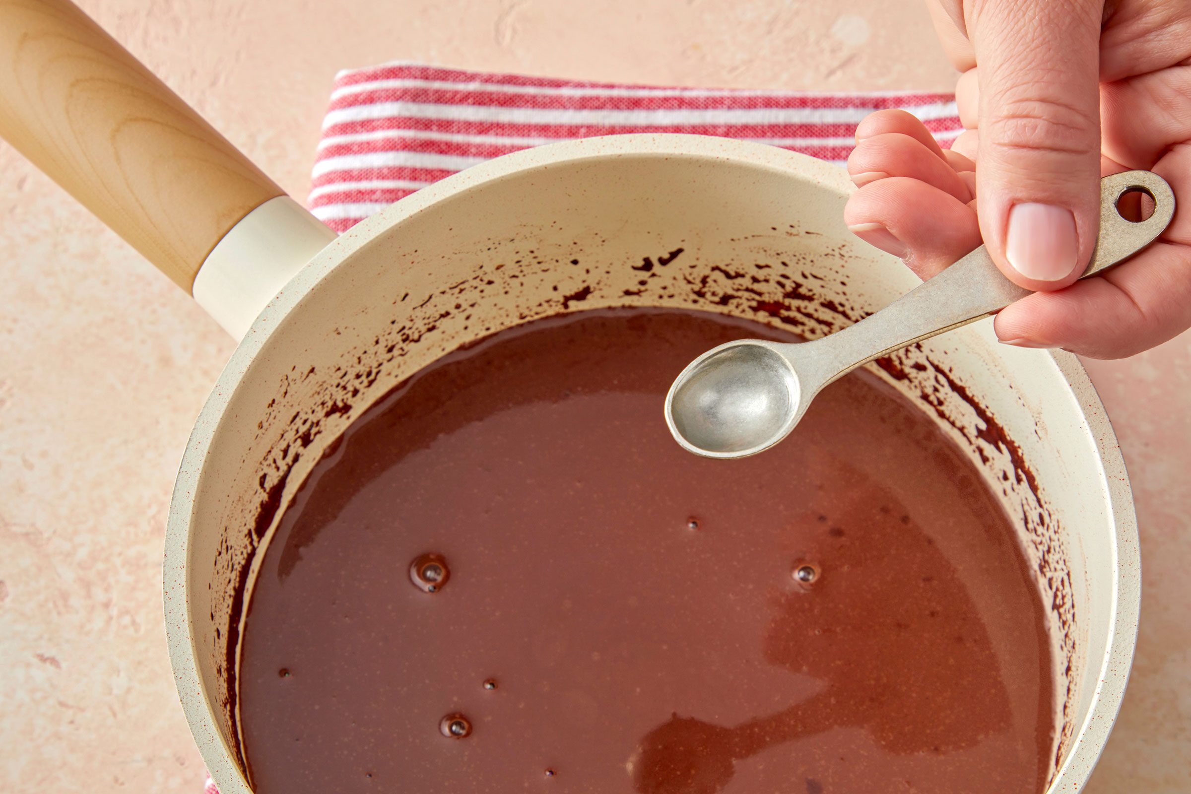 Vanilla and peppermint extract added to hot chocolate