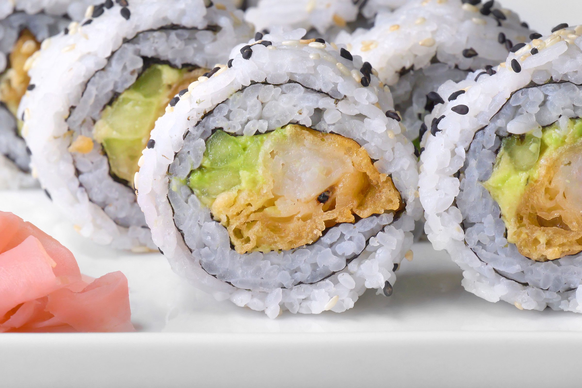 Shrimp Tempura Roll cut into pieces and served on a plate