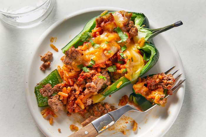 Stuffed Poblano Peppers placed in a serving plate with fork
