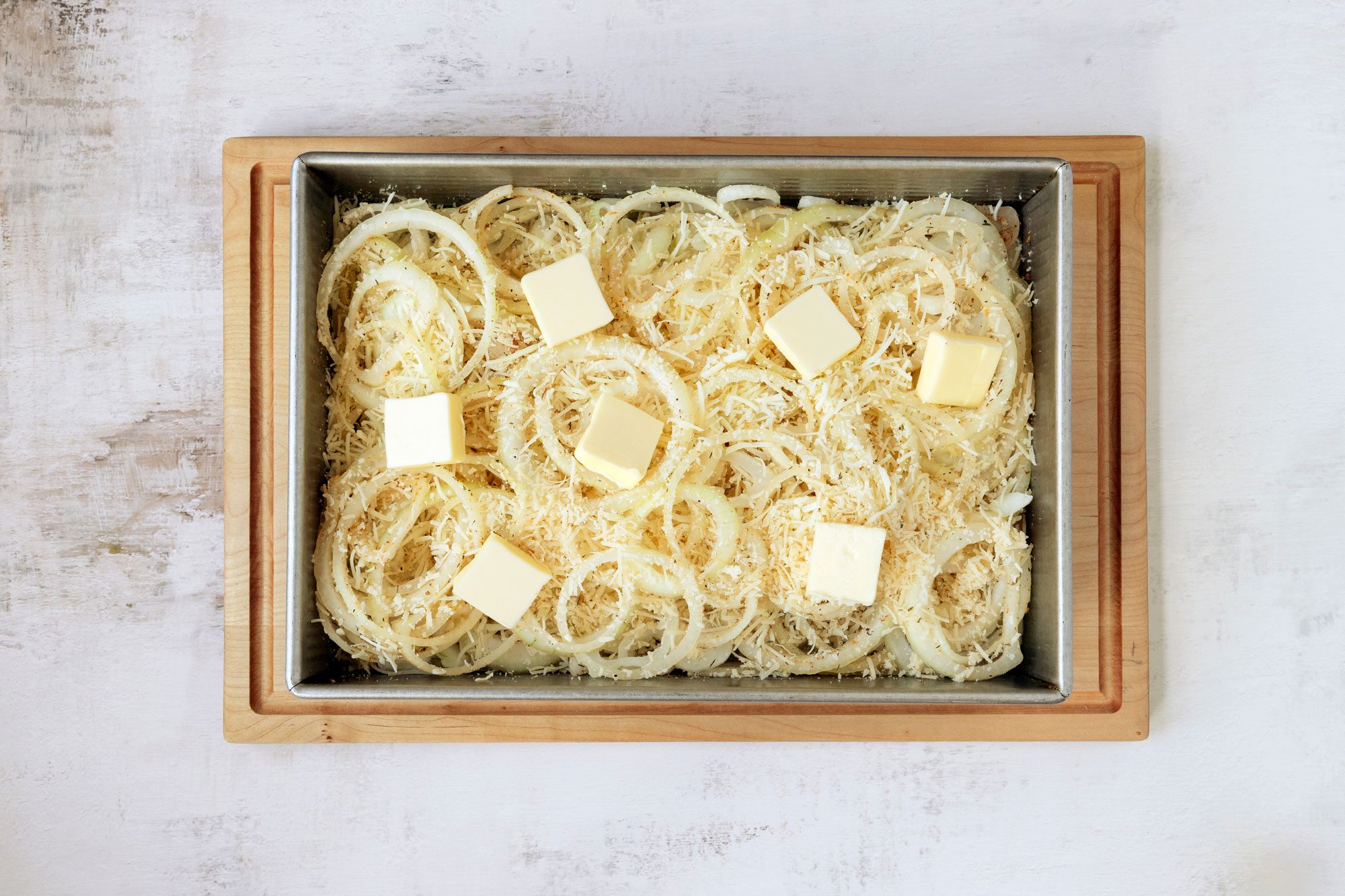 Layer half of the remaining cheese mixture over the onions